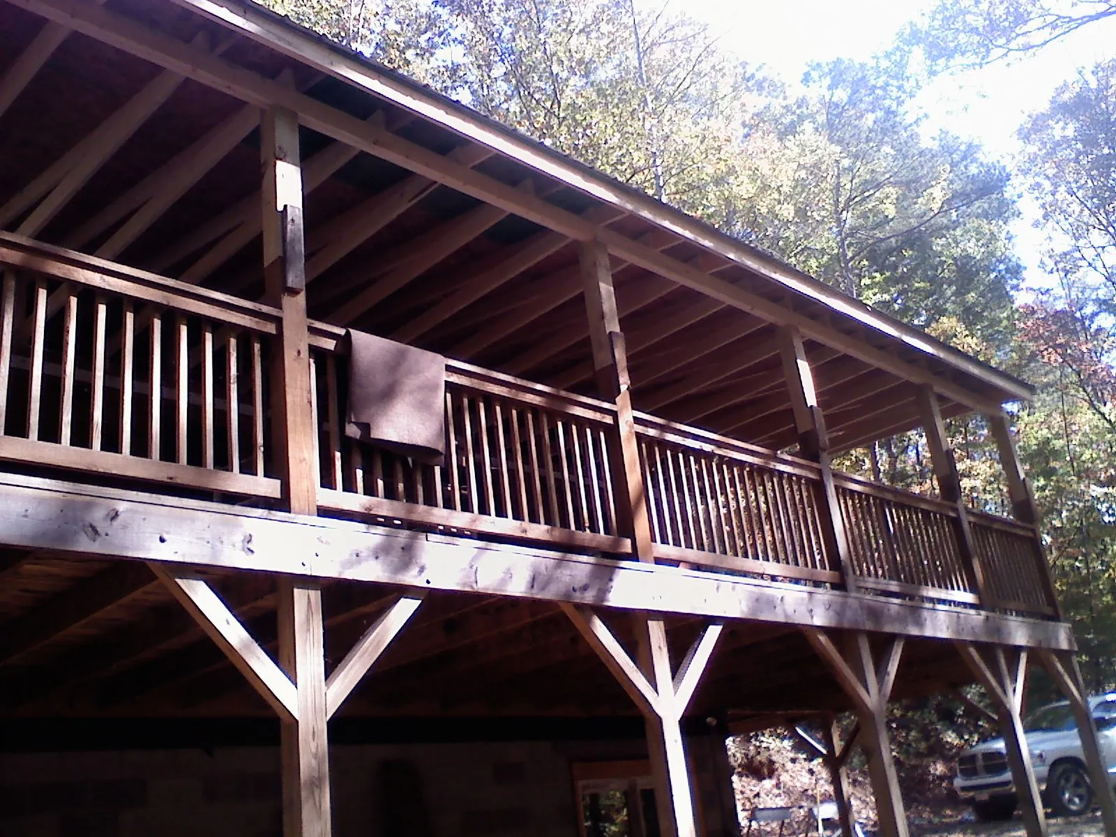 Timber framing under a new elevated porch and deck — Roof Leak Repair in North Liberty by Roofing Brothers